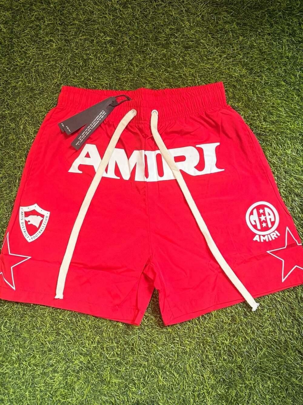 AMIRI Arts District Football Club Shorts in Red
(Size Medium)